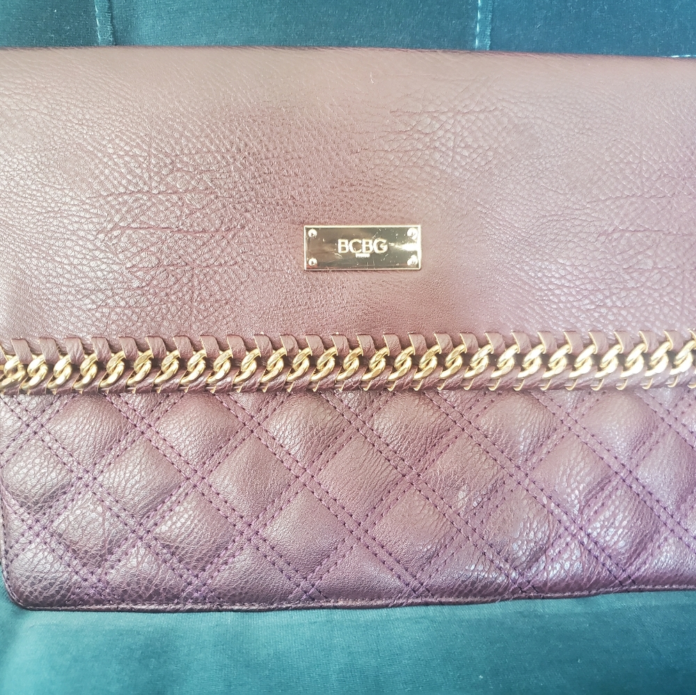 BCBG clutch with gold wrist chain